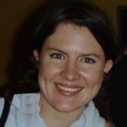 Sylvia Powell Smiling woman with short dark hair
